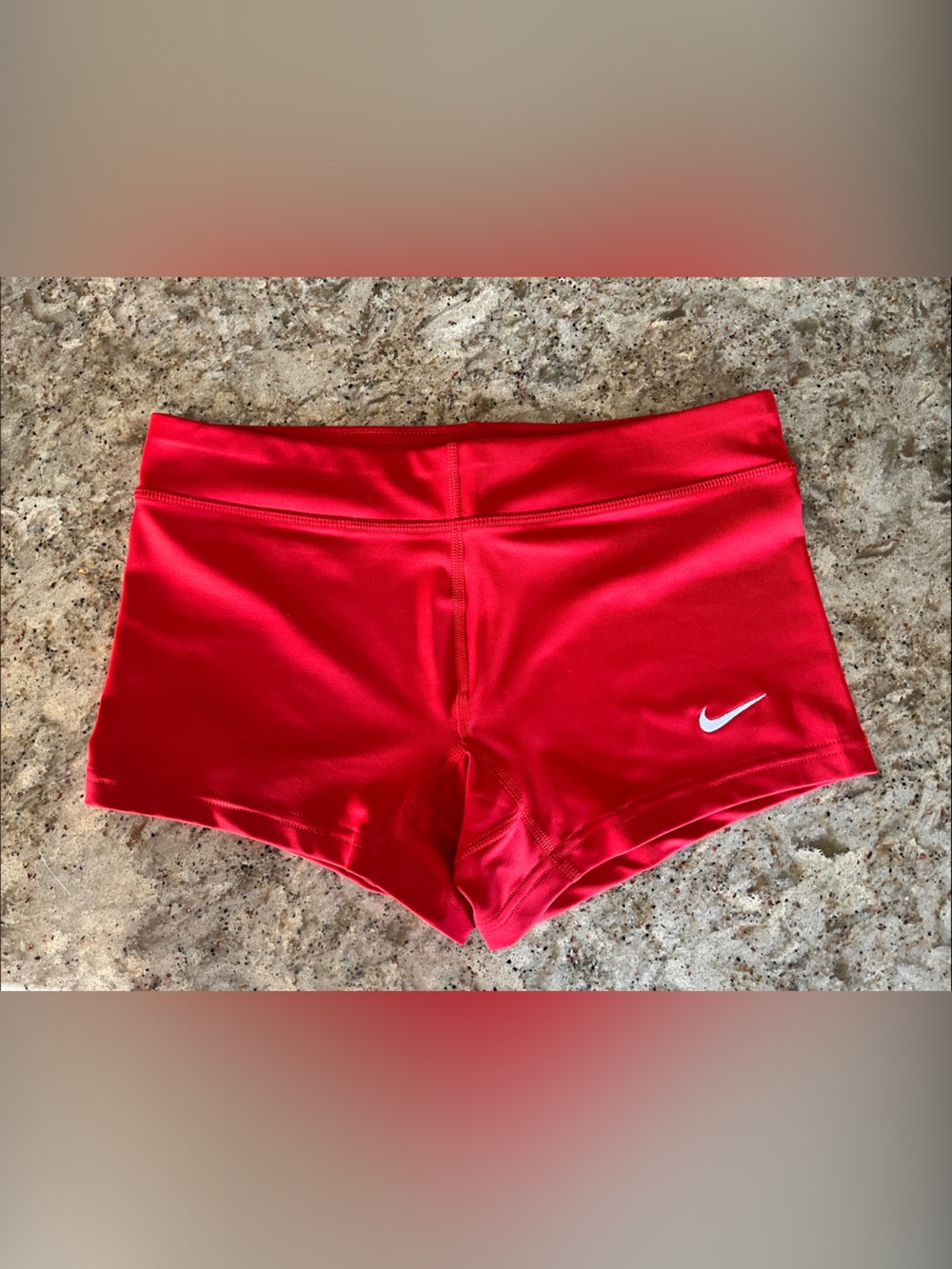 Nike Women's Red High-Waist Athletic Shorts with White Swoosh